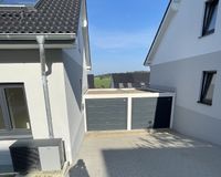 Garage und Stellplatz